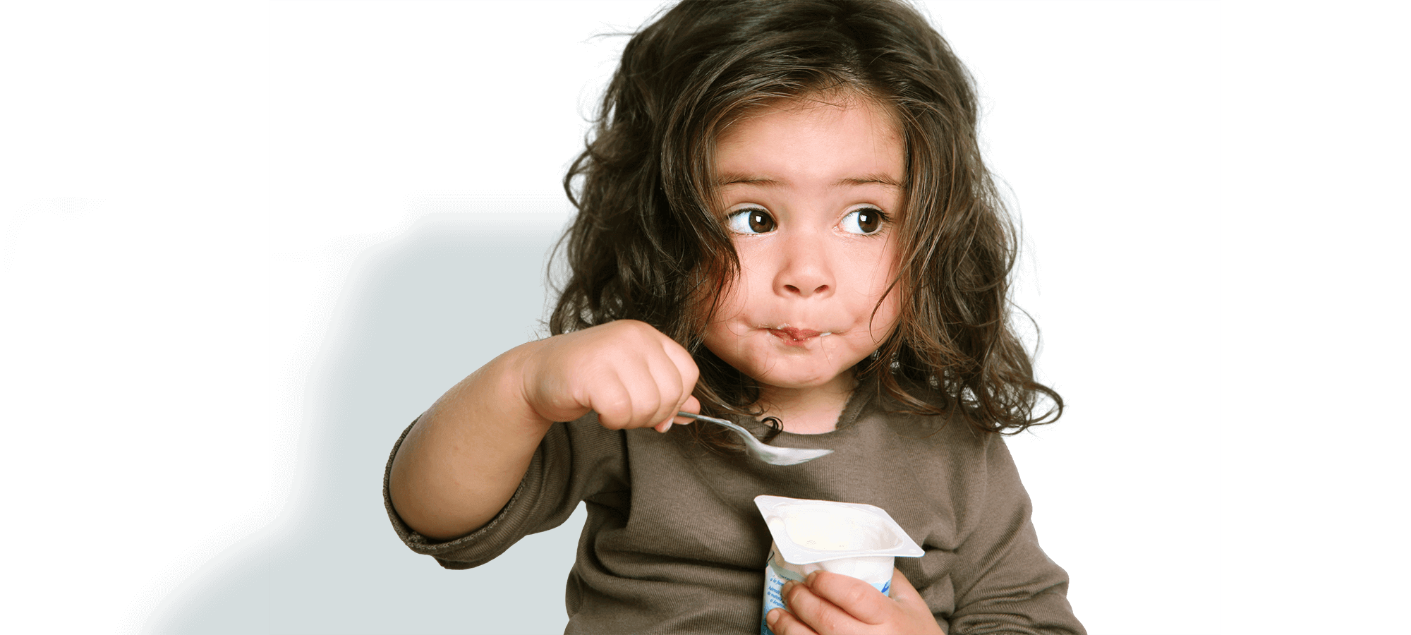 kids klubs gallery page banner photo of girl eating yogurt